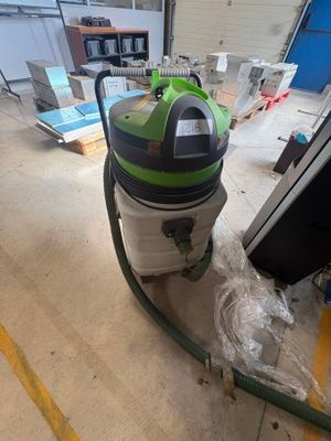 a vacuum that is sitting on the floor in the room