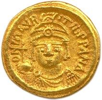 une pièce d'or portant l'image d'un homme