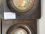 two framed pictures of a woman and a man on a wall