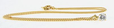 an image of a gold chain bracelet with a diamond on it