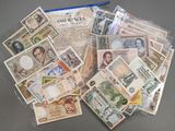 many different types of paper money in a bag