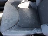 a picture of a seat in a car that is dirty