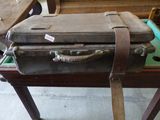 a suitcase sitting on top of a table in a room