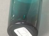 a bottle with a label on it sitting on a table
