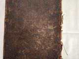 an old book that is sitting on a table