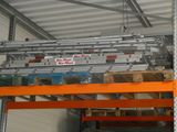 a large metal rack with boxes on it in a warehouse