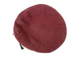 a red hat that is on a white surface