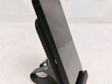 a cell phone that is sitting on top of a stand