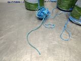 a ball of yarn and a spool of thread on a table