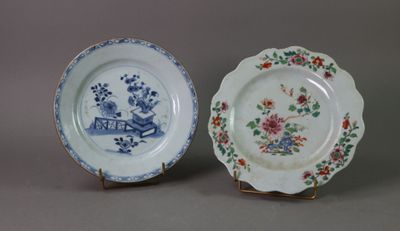 pair of blue and white plates with floral designs on them