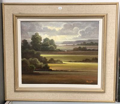 une image représentant un tableau représentant un paysage, encadré et posé sur une étagère