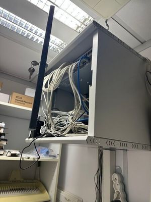 a computer with a bunch of wires on top of it
