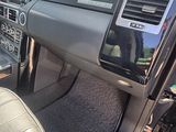 a view of the inside of a car from the driver ' s seat