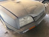 a dirty car that is parked in a garage