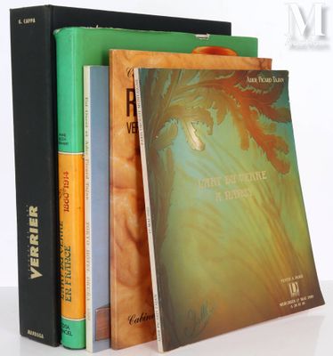 three books are stacked on top of each other on a table