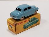 a blue toy car sitting on top of a box