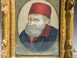 portrait of a bearded man in a red cap