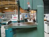 a machine that is sitting in a factory with a lot of machines
