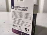 an image of a white box with a purple label on it