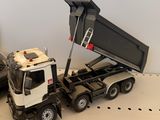 a toy truck that is sitting next to a toy car