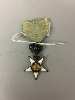 l'image d'une médaille surmontée d'une étoile
