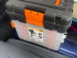several pieces of luggage are stacked on top of each other in a garage
