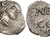 a silver coin with an image of a man on it