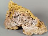 a close up of a piece of rock on a gray surface