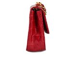 the small red purse is sitting on a white surface