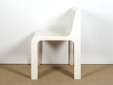 an image of a white chair sitting on top of a carpeted floor