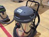 a vacuum that is sitting on the floor in the room