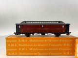 a red and black train car sitting on top of a box