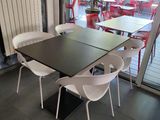 a table and chairs in a room with a sliding glass door