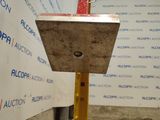 an image of a piece of metal on top of a piece of wood