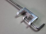 a metal clamp with a metal handle on a table