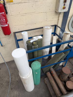 many rolls of paper on a cart next to a fire extinguisor