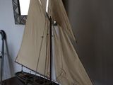 a small sailboat on a table in a room