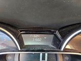 a close up of a car dashboard with a clock on it