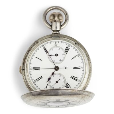 a silver pocket watch with roman numerals on it
