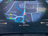a picture of a car ' s dashboard with a map on it