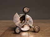 a metal object that is sitting on a wooden table