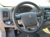 dashboard of a car with a steering wheel and dashboard controls