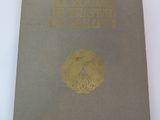 a brown book with a gold emblem on it