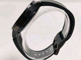 a close up of a watch on a clear stand