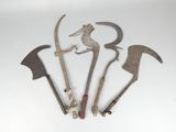 several old tools are displayed on a white surface