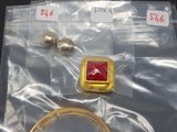 some gold and red items in a bag on a table