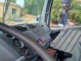 a view of the inside of a truck from the driver ' s seat