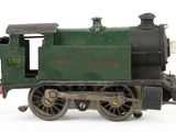 a toy train on a white surface with a white background
