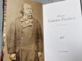 someone is holding a book with a picture of a man in a coat