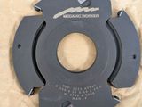 a close up of a circular cutter on a piece of paper